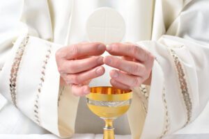 Priest celebrating the Eucharist